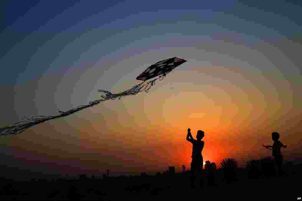 A child flies a kite at Al-Azhar Park in Cairo, Egypt.