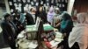 A group of women looking at the war victims mementos boxes during a workshop in Kabul Afghanistan. (Photo: Afghanistan Human Rights and Democracy Organization)