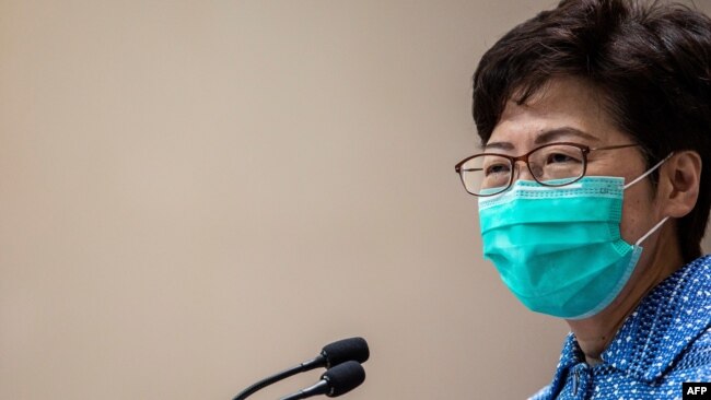 Hong Kong's Chief Executive Carrie Lam takes part in a press conference while wearing a face mask in Hong Kong on March 3, 2020. 