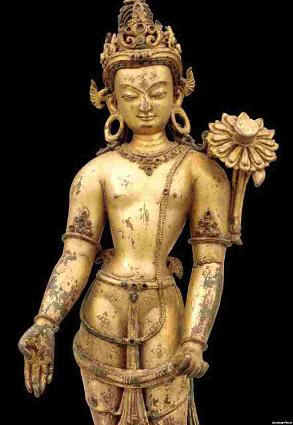 The Bodhisattva of Compassion, Avalokiteshvara, is one of the most popular deities in Nepal, where 108 forms of him are known. In his simplest form, extending his right hand in the gesture of giving and holding the stalk of a lotus (now broken) in his left hand. (Rubin Museum of Art)