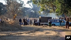A group pf Zanu PF members camp outside Zimbabwe's deputy Minster of Labour, Tracy Mutinhiris farm in Marondera about 120 kilometres east of Harare. The group tried to take over her farm following allegations that she is sympathetic to Zimbabwes Prime Mi