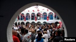 Tunisian Jews and Muslims attend a ceremony at Ghriba, the oldest Jewish synagogue in Africa, during an annual pilgrimage in Djerba, Tunisia, May 2, 2018. 
