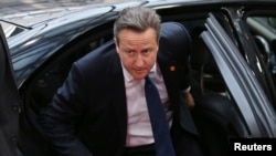 Britain's Prime Minister David Cameron arrives at an European Union leaders summit in Brussels, June 27, 2014.