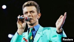 FILE - David Bowie performs on stage during The Freddie Mercury Tribute Concert at Wembley Stadium in London, Britain.