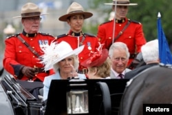 Camilla, Duchess of Cornwall, and Britain's Prince Charles arrive on Parliament Hill during Canada Day celebrations as the country marks its 150th anniversary since confederation, in Ottawa, Ontario, July 1, 2017.