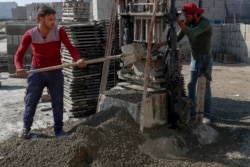 Palestinian workers make concrete bricks from recycled rubble. (AP Photo/Adel Hana)