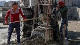Palestinian workers make concrete bricks from recycled rubble. (AP Photo/Adel Hana)