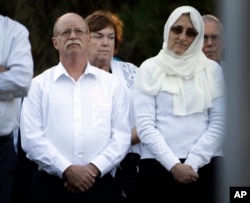 FILE - Ed Kassig, left, and wife Paula listen during a vigil for their son Abdul-Rahman Kassig, at Butler University in Indianapolis, Oct. 8, 2014.