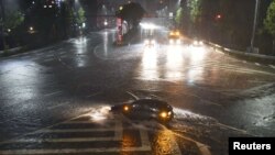 A water-covered road caused by heavy rains from Typhoon Lan is seen in Nagoya, Japan, in this photo taken by Kyodo, Oct. 22, 2017.