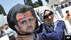 A demonstrator poses with an effigy of Syria's President Bashar al-Assad during a protest in Istanbul June 24, 2011. Due to restricted foreign media access, few images of anti-government protests within Syria have made it out of that country.