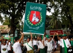 Supporters of military-backed Union Solidarity and Development Party (USDP) dance in front of USDP regional office during a campaign rally for the upcoming general election in Meiktila, Mandalay Region, Myanmar, Nov. 4, 2015.