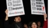 FILE - People shout slogans as they hold placards that read "stop censorship" during a rally in Ankara, Turkey, Jan. 18, 2014.