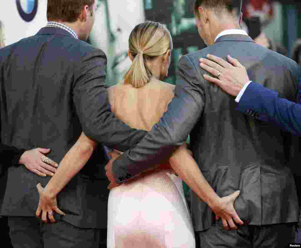 Cast members Ryan Hansen (left), Kristena Bell (Center), and Jason Dohring (right) pose at the premiere of "Veronica Mars" in Hollywood, California, Mar. 12, 2014.