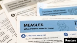 FILE PHOTO: Materials are seen left at demonstration by people opposed to childhood vaccination after officials in Rockland County, a New York City suburb, banned children not vaccinated against measles from public spaces.