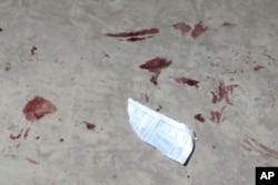 This March 21, 2021 photo obtained by The Associated Press shows blood stains left behind following a raid by Myanmar's security forces on an autobody shop in Yangon, Myanmar. (AP Photo)