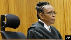 FILE - Judge Thokozile Masipa listens in court in Pretoria, South Africa in the case against Oscar Pistorius.