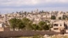 A general view shows Khan al-Assal area near the northern city of Aleppo, Syria, near the site where forces loyal to Syria's President Bashar al-Assad claim was Tuesday's chemical weapon attack, March 23, 2013.