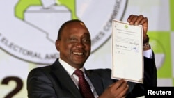 President-elect Uhuru Kenyatta displays the certificate from Independent Electoral and Boundaries Commission (IEBC) declaring him the winner of the country's presidential election in Nairobi, Mar. 9, 2013. 