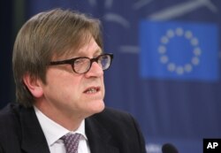FILE - Belgium's Guy Verhofstadt, leader of the liberal group of lawmakers in the European Parliament, slammed President Donald Trump's decision on the Paris climate accord by revising Trump's campaign slogan: "Make America small again."