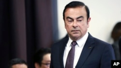 FILE - Then-Nissan Motor Co. President and CEO Carlos Ghosn arrives for a joint press conference with Mitsubishi Motors Corp. in Yokohama, near Tokyo, May 12, 2016.