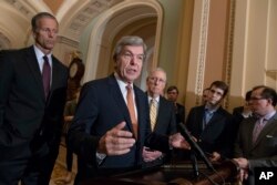 FILE - Sen. Roy Blunt, R-Mo., speaks to reporters at the Capitol in Washington, Aug. 21, 2018.