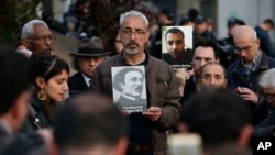 Protesters hold portraits of Armenian intellectuals during a rally held to commemorate the 104th anniversary of the 1915 mass killing of Armenians in Istanbul, April 24, 2019.