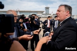 FILE - U.S. Secretary of State Mike Pompeo speaks to members of the media following two days of meetings with Kim Yong Chol, a North Korean senior ruling party official and former intelligence chief, before boarding his plane at Sunan International Airport in Pyongyang, North Korea, July 7, 2018.
