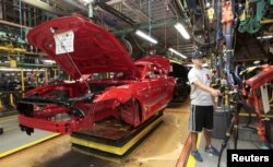 FILE - The frame of a 2015 Ford Mustang vehicle moves down the production line at the Ford Motor Flat Rock Assembly Plant in Flat Rock, Michigan, U.S. Aug. 20, 2015.