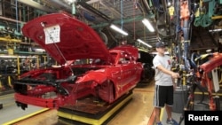 FILE - The frame of a 2015 Ford Mustang vehicle moves down the production line at the Ford Motor Flat Rock Assembly Plant in Flat Rock, Michigan, U.S. Aug. 20, 2015. 