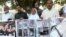 Relatives of victims of a 2007 train explosion in India hold a protest in Lahore, Pakistan, March 25, 2019. 