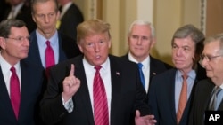FILE - In this Jan. 9, 2019 photo, Sen. John Barrasso, R-Wyo., left, and Sen. John Thune, R-S.D., stand with President Donald Trump, Vice President Pence, Sen. Roy Blunt, R-Mo., and Senate Majority Leader Mitch McConnell, at the Capitol.