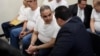 Former Salvadoran President (2004-2009) Elias Antonio Saca (C) talks with his lawyer as he waits to hear his sentence alonside five of his collaborators at a courtroom in San Salvador on September 12, 2018. - Saca was sentenced to ten years in jain for…