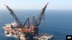 FILE - An oil platform is seen in the Leviathan natural gas field, in the Mediterranean Sea off the Israeli coast. Israel became a major energy exporter Dec. 16, 2019, after signing a permit to export natural gas to neighboring Egypt.