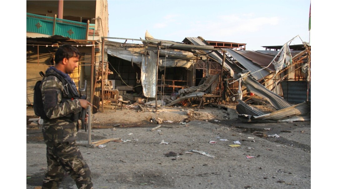 FILE - Afghan security personnel arrive at the site of suicide attack in Jalalabad east of Kabul, Afghanistan, Oct. 25, 2019. The Taliban claimed responsibility for the attack.
