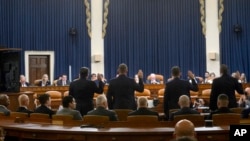 Witnesses stand to be sworn-in during a House Task Force hearing on the July 13 assassination attempt of Republican presidential nominee former President Donald Trump, on Capitol Hill, in Washington, Sept. 26, 2024.