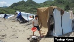 올 여름 수해가 심각한 북한 평안남도 성천군의 한 마을.