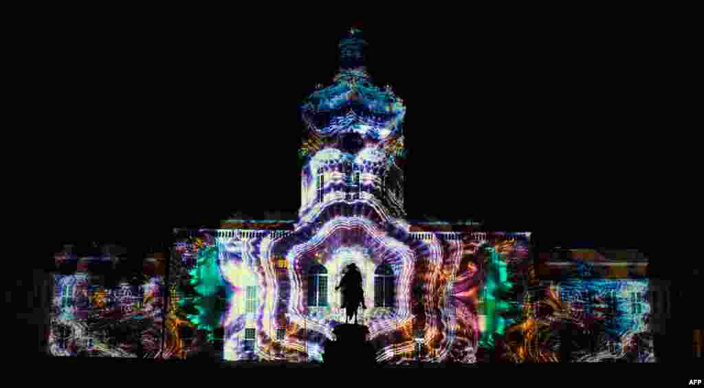 Colourful designs are projected on the facade of the Charlottenburg Palace as part of the yearly Festival of Lights in Berlin, Germany, Sept. 14, 2020.