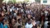 FILE - Members of the LRA community living at Koch Goma IDP camp in Gulu, Northern Uganda raise their hands after having been asked if they were ready to forgive the atrocities of the past 20 years.