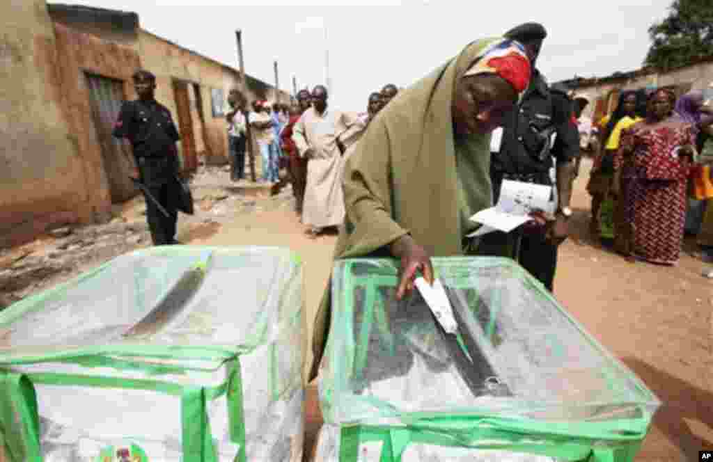 A woman prepares to cast her vote in Kaduna, Nigeria, Thursday, April 28, 2011. Small crowds of voters nervously cast ballots Thursday in two states in oil-rich Nigeria hit hard by religious rioting that killed at least 500 people following the nation's 