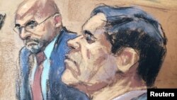 FILE - The accused Mexican drug lord Joaquin "El Chapo" Guzman (R), appears with defense attorney A. Eduardo Balarezo (L) in this courtroom sketch as he appears in Brooklyn federal court in New York, Nov. 19, 2018.