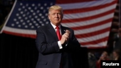 FILE - U.S. President-elect Donald Trump arrives to speak during one of his "thank-you tour" events at Giant Center in Hershey, Pennsylvania, Dec. 15, 2016.