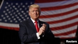 FILE - Donald Trump, at the time still President-elect, arrives to speak during a "Thank you" tour event at Giant Center in Hershey, Pennsylvania, Dec. 15, 2016.