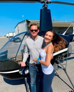 This undated photo provided by John Pilkington shows helicopter pilot Joel Boyer and his fiancee, Melody Among, at John C. Tune airport in Nashville, Tennessee.