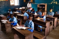 Students of Rising Sun Children School wear face masks as a preventive measure to curb the spread of the COVID-19 coronavirus in their classroom in Yaba, Lagos, on Oct. 12, 2020.