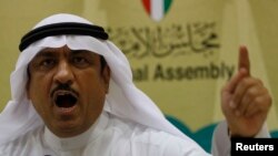 FILE - Musallam al-Barrak, who at the time was a Kuwaiti lawmaker, gestures while speaking to journalists at Parliament's media center in Kuwait City, Nov. 20, 2011. He was later jailed for criticizing an election law.