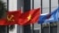 FILE PHOTO: Flag of PetroVietnam flutters next to Vietnamese national flag and Communist Party flag in front of the headquarters of PetroVietnam in Hanoi Jan. 11, 2016. 