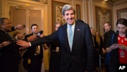 Senator John Kerry emerges after a unanimous vote by the Senate Foreign Relations Committee approving him to become America's next top diplomat, January 29, 2013. 