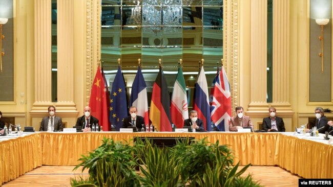 FILE - Attendees wait for the start of a meeting of the JCPOA Joint Commission in Vienna, Austria, April 17, 2021. (EU Delegation in Vienna/Handout via Reuters)