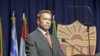 Former California Gov. Arnold Schwarzenegger delivers the keynote address at the inaugural symposium sponsored by the Schwarzenegger Institute for State and Global Policy, at the University of Southern California in Los Angeles, Sept. 24, 2012. 