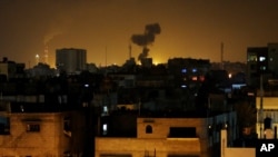 Smoke rises after an Israeli missile strike in Beit Lahia, northern Gaza Strip, July 7, 2014.